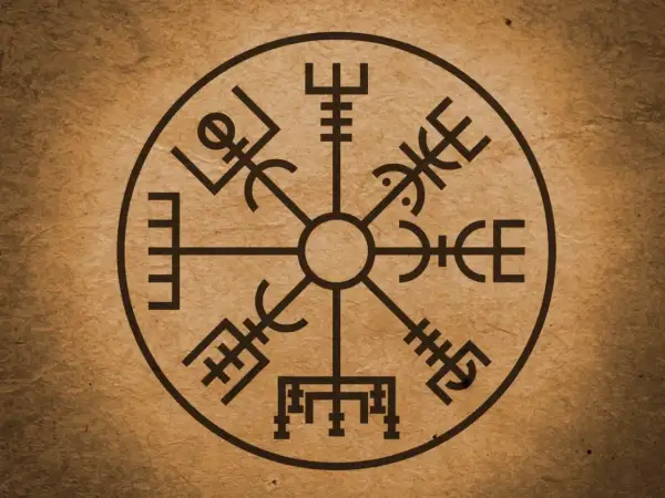 Runiczny kompas Vegvísir na brązowym tle.
